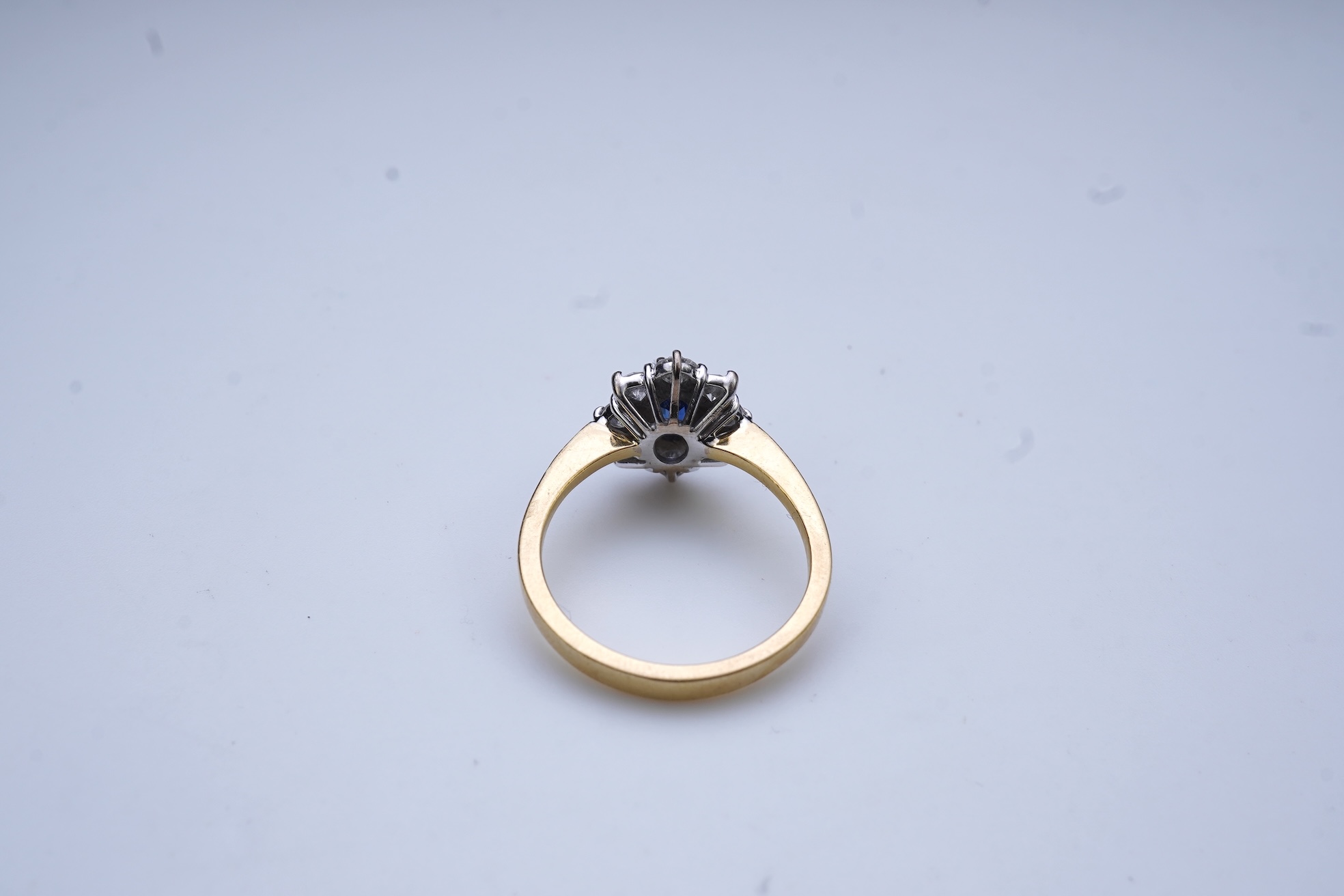 A sapphire and diamond cluster ring